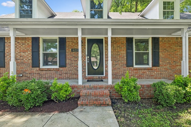 623 Haynes Dr, Murfreesboro, TN 37129 - doorway to property featuring a porch and brick siding