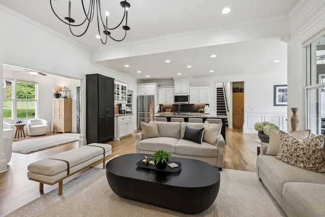 967 Nashs Nook, Columbia, TN 38401 - living area featuring light wood-style flooring, crown molding, a chandelier, recessed lighting, and a wainscoted wall
