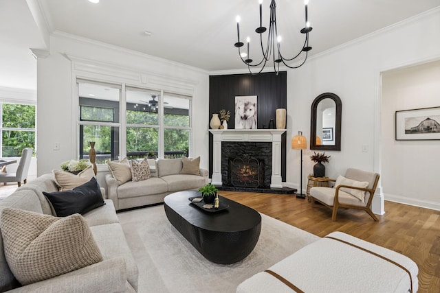 967 Nashs Nook, Columbia, TN 38401 - living room with wood finished floors, ornamental molding, plenty of natural light, a chandelier, and a fireplace