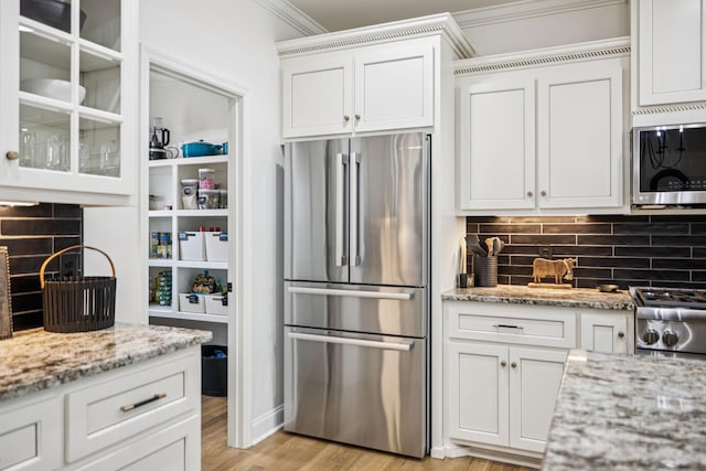 967 Nashs Nook, Columbia, TN 38401 - kitchen with appliances with stainless steel finishes, ornamental molding, tasteful backsplash, and white cabinets