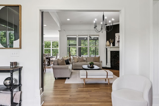 967 Nashs Nook, Columbia, TN 38401 - living room featuring ornamental molding, wood finished floors, plenty of natural light, a chandelier, and a premium fireplace