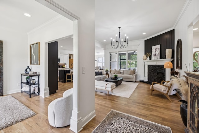 967 Nashs Nook, Columbia, TN 38401 - living room featuring crown molding, a chandelier, wood finished floors, recessed lighting, and a fireplace
