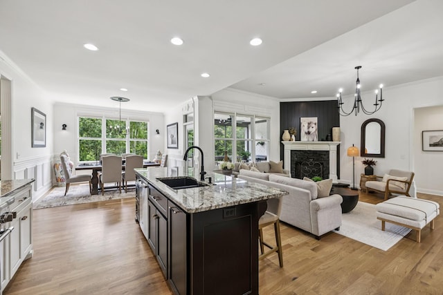 967 Nashs Nook, Columbia, TN 38401 - kitchen featuring a chandelier, crown molding, a breakfast bar area, light stone countertops, and open floor plan