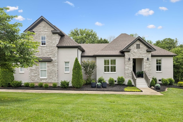 967 Nashs Nook, Columbia, TN 38401 - french country inspired facade with stone siding, a front yard, a shingled roof, and brick siding