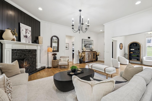967 Nashs Nook, Columbia, TN 38401 - living room with a chandelier, wood finished floors, crown molding, recessed lighting, and a stone fireplace