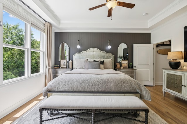 967 Nashs Nook, Columbia, TN 38401 - bedroom featuring an accent wall, multiple windows, wood finished floors, a raised ceiling, and ornamental molding