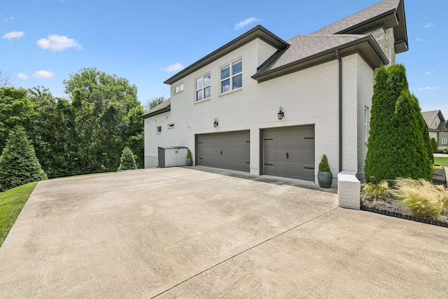 967 Nashs Nook, Columbia, TN 38401 - view of home's exterior with brick siding, an attached garage, concrete driveway, and a shingled roof