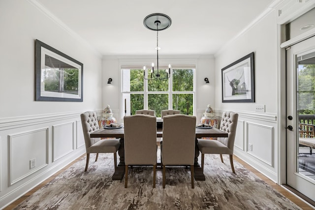 967 Nashs Nook, Columbia, TN 38401 - dining area with a decorative wall, ornamental molding, a chandelier, a wainscoted wall, and wood finished floors