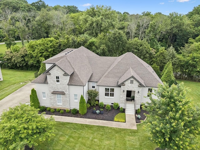 967 Nashs Nook, Columbia, TN 38401 - view of front of home featuring stone siding, roof with shingles, and a front yard