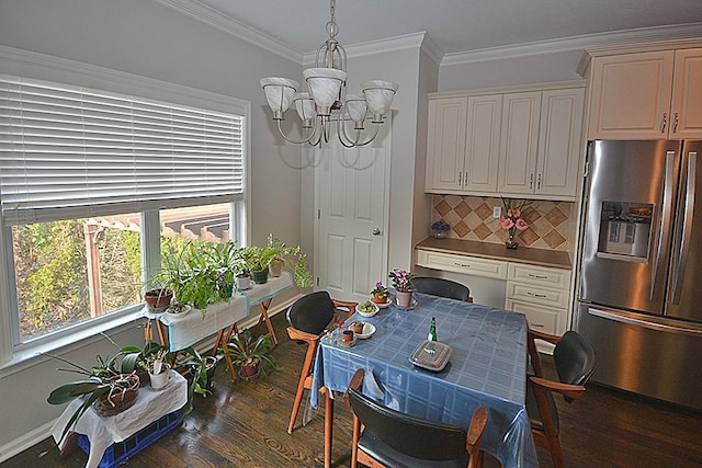 502 Johnstown Dr, Smyrna, TN 37167 - dining space with a chandelier, wood finished floors, and crown molding