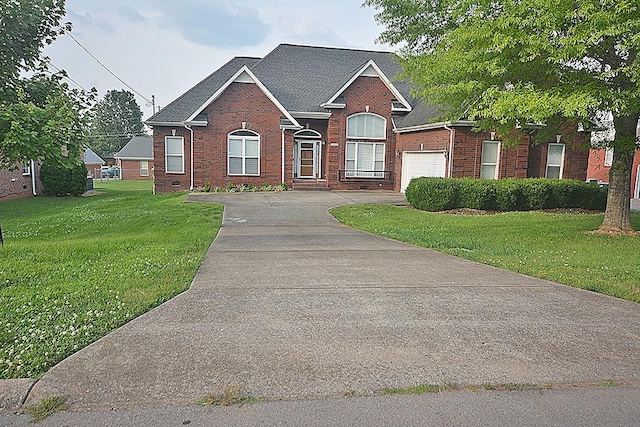 502 Johnstown Dr, Smyrna, TN 37167 - view of front of house with brick siding, driveway, a front lawn, and a garage