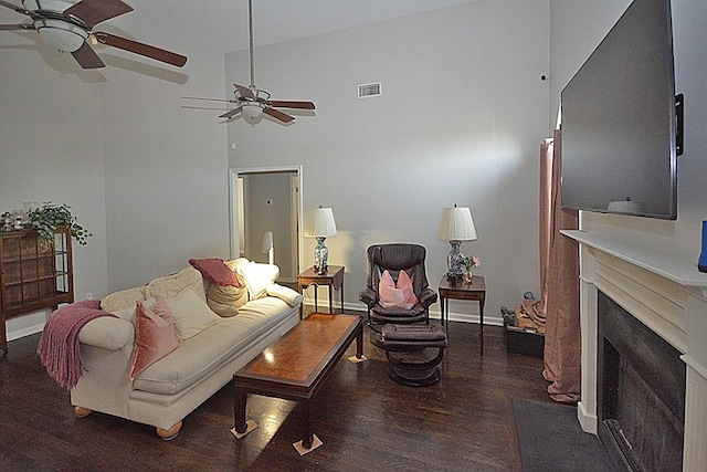 502 Johnstown Dr, Smyrna, TN 37167 - living area featuring wood finished floors, a ceiling fan, and a fireplace with raised hearth
