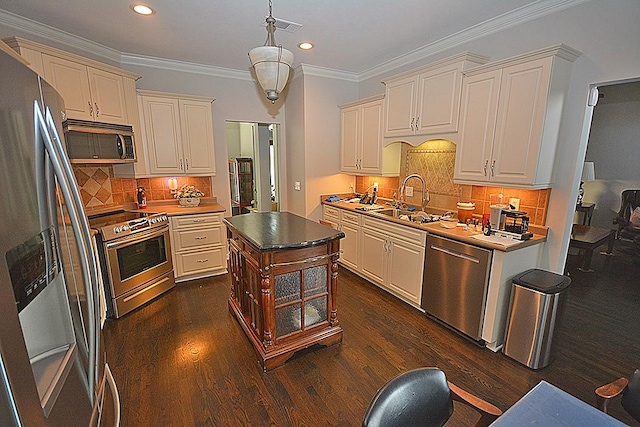 502 Johnstown Dr, Smyrna, TN 37167 - kitchen featuring stainless steel appliances, cream cabinetry, decorative backsplash, recessed lighting, and dark wood-type flooring
