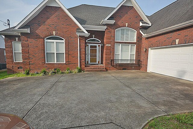 502 Johnstown Dr, Smyrna, TN 37167 - traditional-style home with brick siding, driveway, and a shingled roof