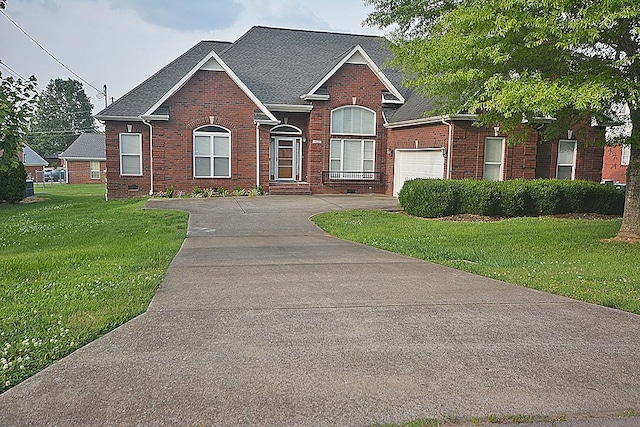 502 Johnstown Dr, Smyrna, TN 37167 - traditional-style home with brick siding, driveway, a front lawn, and a garage