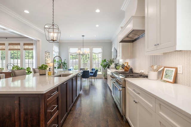 1014B Noelton Ave, Nashville, TN 37204 - kitchen featuring premium range hood, appliances with stainless steel finishes, a chandelier, white cabinets, and light countertops