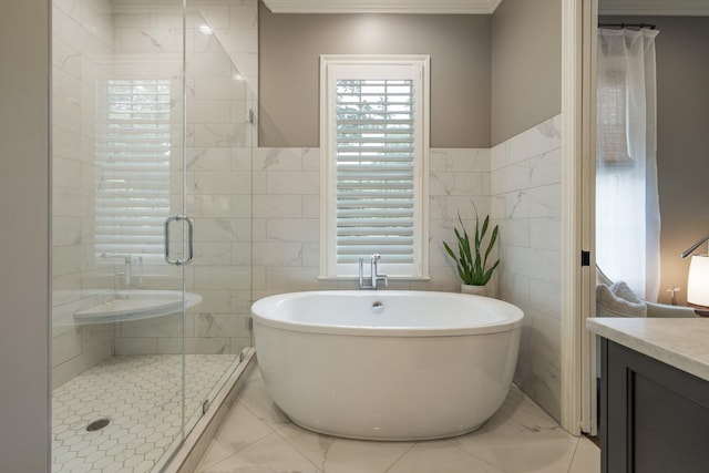 1014B Noelton Ave, Nashville, TN 37204 - bathroom with tile walls, vanity, marble look tiles, a freestanding tub, and a stall shower