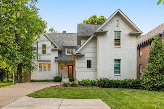 1014B Noelton Ave, Nashville, TN 37204 - view of front of property featuring roof with shingles, a front lawn, and brick siding