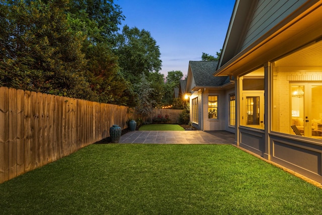 1014B Noelton Ave, Nashville, TN 37204 - yard at dusk featuring a patio area and a fenced backyard