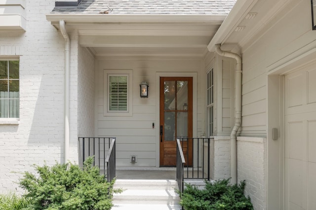 1014B Noelton Ave, Nashville, TN 37204 - view of exterior entry featuring a porch, a shingled roof, and brick siding
