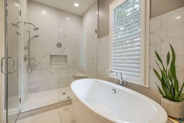 1014B Noelton Ave, Nashville, TN 37204 - bathroom with tile walls, a soaking tub, and a stall shower
