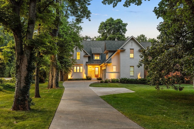 1014B Noelton Ave, Nashville, TN 37204 - view of front of home with a front lawn, driveway, and roof with shingles