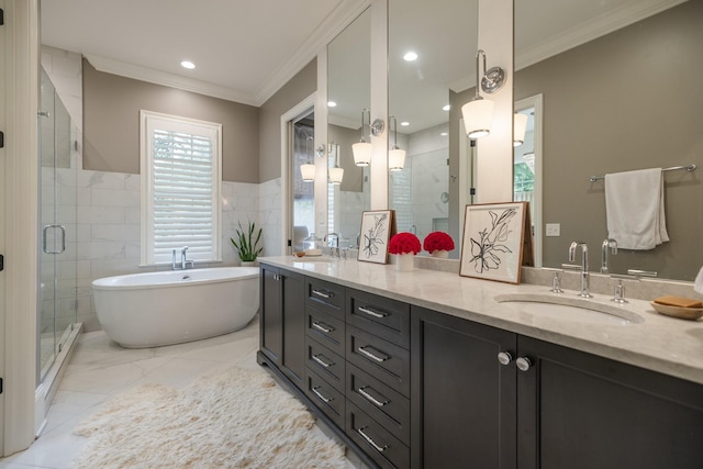 1014B Noelton Ave, Nashville, TN 37204 - bathroom featuring crown molding, a shower stall, double vanity, a soaking tub, and tile walls