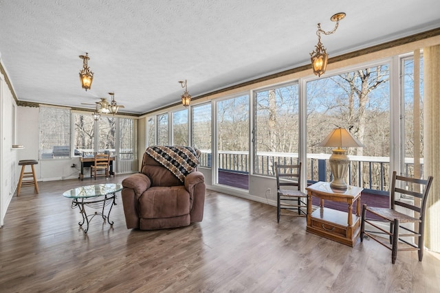 2220 Potts Camp Rd, Smithville, TN 37166 - sunroom with a textured ceiling, wood finished floors, and crown molding