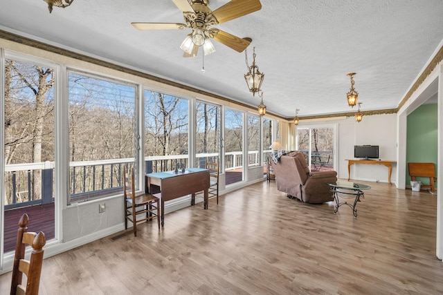 2220 Potts Camp Rd, Smithville, TN 37166 - sunroom featuring a textured ceiling, plenty of natural light, crown molding, and wood finished floors