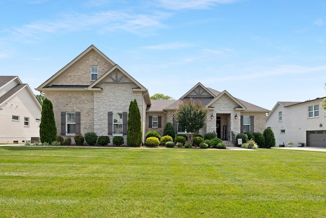 2003 Imagine Cir, Spring Hill, TN 37174 - view of front facade featuring stone siding and a front lawn