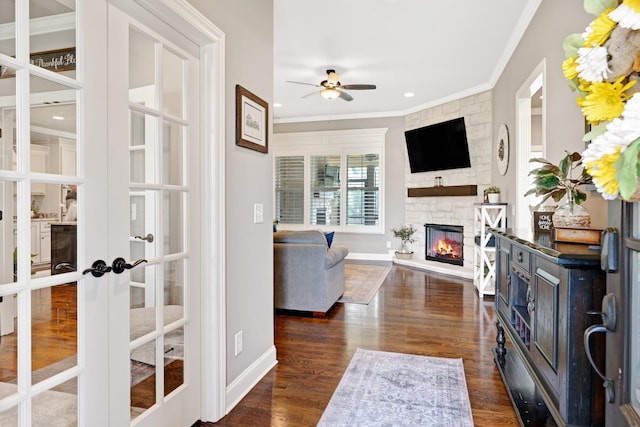 2003 Imagine Cir, Spring Hill, TN 37174 - living area featuring french doors, ornamental molding, a ceiling fan, a fireplace, and dark wood-style floors