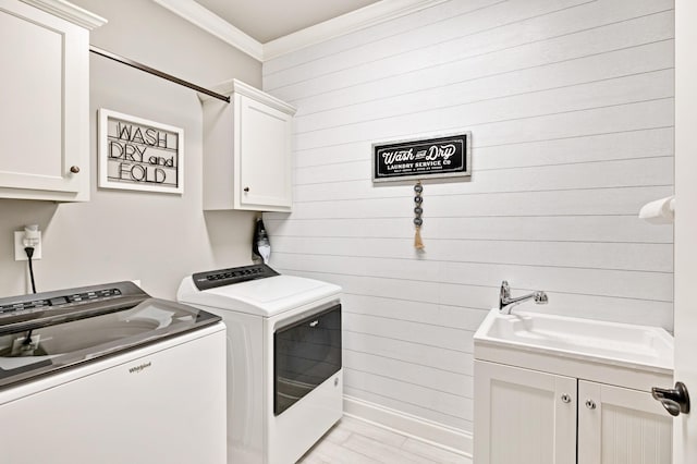 2003 Imagine Cir, Spring Hill, TN 37174 - laundry area featuring washer and clothes dryer, cabinet space, wooden walls, and ornamental molding