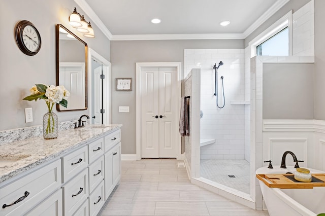 2003 Imagine Cir, Spring Hill, TN 37174 - bathroom with walk in shower, double vanity, a freestanding bath, ornamental molding, and recessed lighting