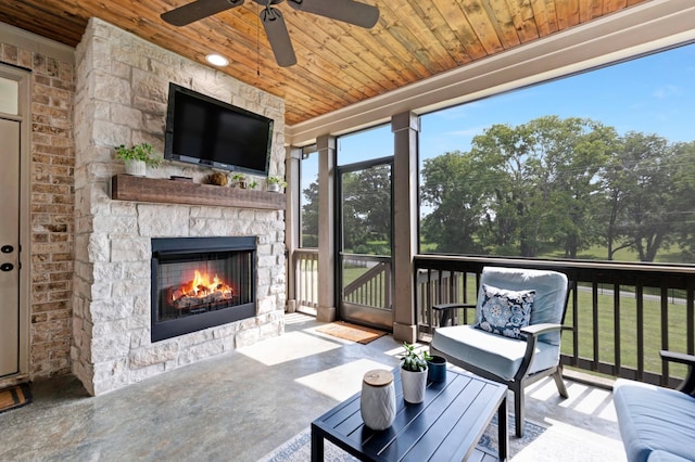 2003 Imagine Cir, Spring Hill, TN 37174 - sunroom / solarium with an outdoor stone fireplace and ceiling fan