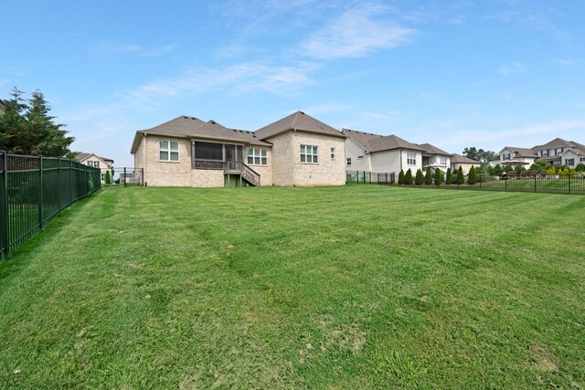 2003 Imagine Cir, Spring Hill, TN 37174 - rear view of property featuring a fenced backyard, a residential view, and a sunroom