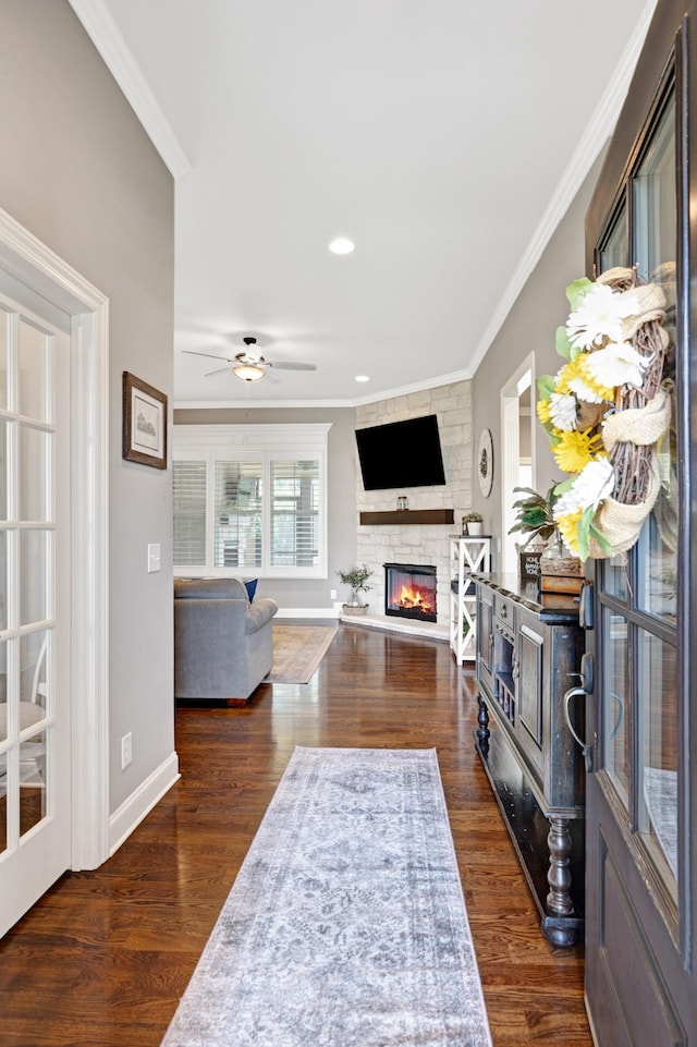 2003 Imagine Cir, Spring Hill, TN 37174 - living area with crown molding, a stone fireplace, a ceiling fan, dark wood-style floors, and recessed lighting