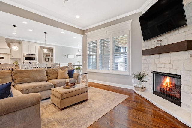 2003 Imagine Cir, Spring Hill, TN 37174 - living room with ornamental molding, a fireplace, wood finished floors, and recessed lighting