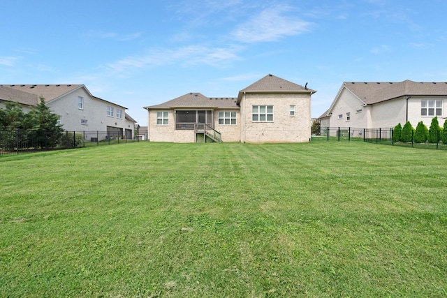 2003 Imagine Cir, Spring Hill, TN 37174 - back of house with a fenced backyard and brick siding