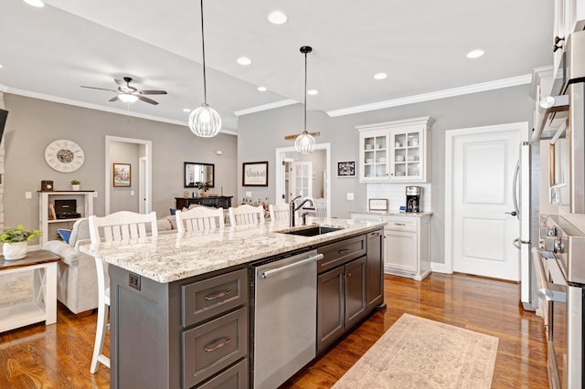 2003 Imagine Cir, Spring Hill, TN 37174 - kitchen with appliances with stainless steel finishes, a breakfast bar area, white cabinets, ceiling fan, and open floor plan