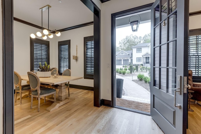 325 Fairpark Ct, Franklin, TN 37064 - dining space featuring light wood finished floors, crown molding, and a chandelier