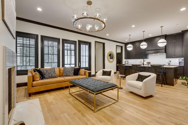 325 Fairpark Ct, Franklin, TN 37064 - living area featuring crown molding, light wood-type flooring, recessed lighting, and a chandelier