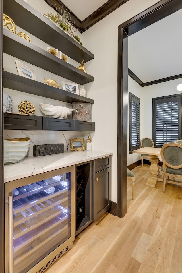 325 Fairpark Ct, Franklin, TN 37064 - indoor dry bar with ornamental molding, beverage cooler, and light wood-style floors