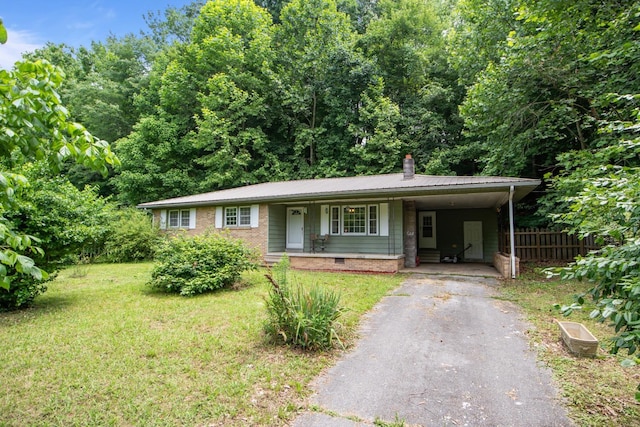 203 Lomax Ave, Waverly, TN 37185 - ranch-style home featuring asphalt driveway, a carport, a chimney, crawl space, and covered porch