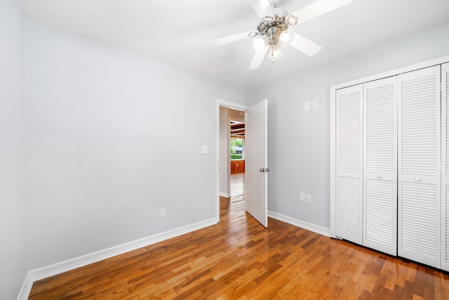 3509 Lafayette Rd, Hopkinsville, KY 42240 - unfurnished bedroom featuring light wood finished floors, a closet, and a ceiling fan