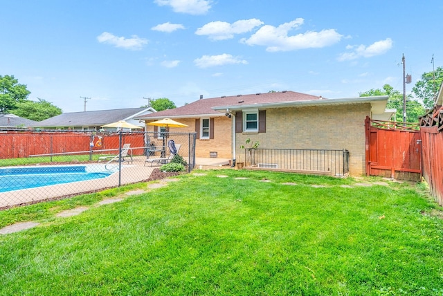 3509 Lafayette Rd, Hopkinsville, KY 42240 - back of property featuring brick siding, a fenced backyard, and a patio area