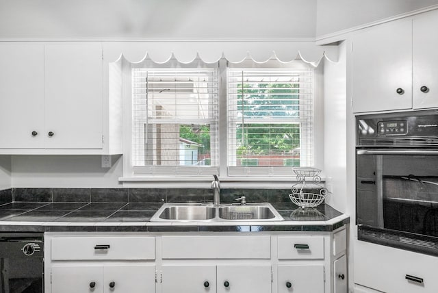 3509 Lafayette Rd, Hopkinsville, KY 42240 - kitchen with black oven and white cabinetry