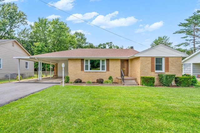 3509 Lafayette Rd, Hopkinsville, KY 42240 - single story home with brick siding, driveway, a carport, and a shingled roof