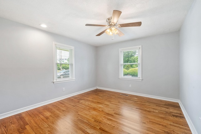 3509 Lafayette Rd, Hopkinsville, KY 42240 - spare room featuring healthy amount of natural light, light wood-style flooring, and a ceiling fan