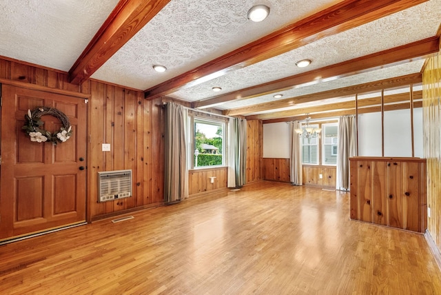 3509 Lafayette Rd, Hopkinsville, KY 42240 - foyer featuring light wood-type flooring, heating unit, a textured ceiling, a chandelier, and wood walls