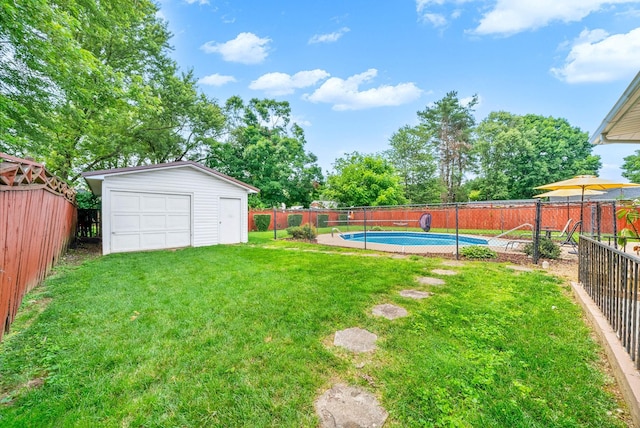 3509 Lafayette Rd, Hopkinsville, KY 42240 - fenced backyard with an outbuilding and a garage